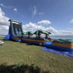 Beach Vibe giant inflatable slide at a stadium field day