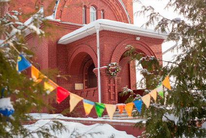 Church fall festival with inflatable attractions and a crowd